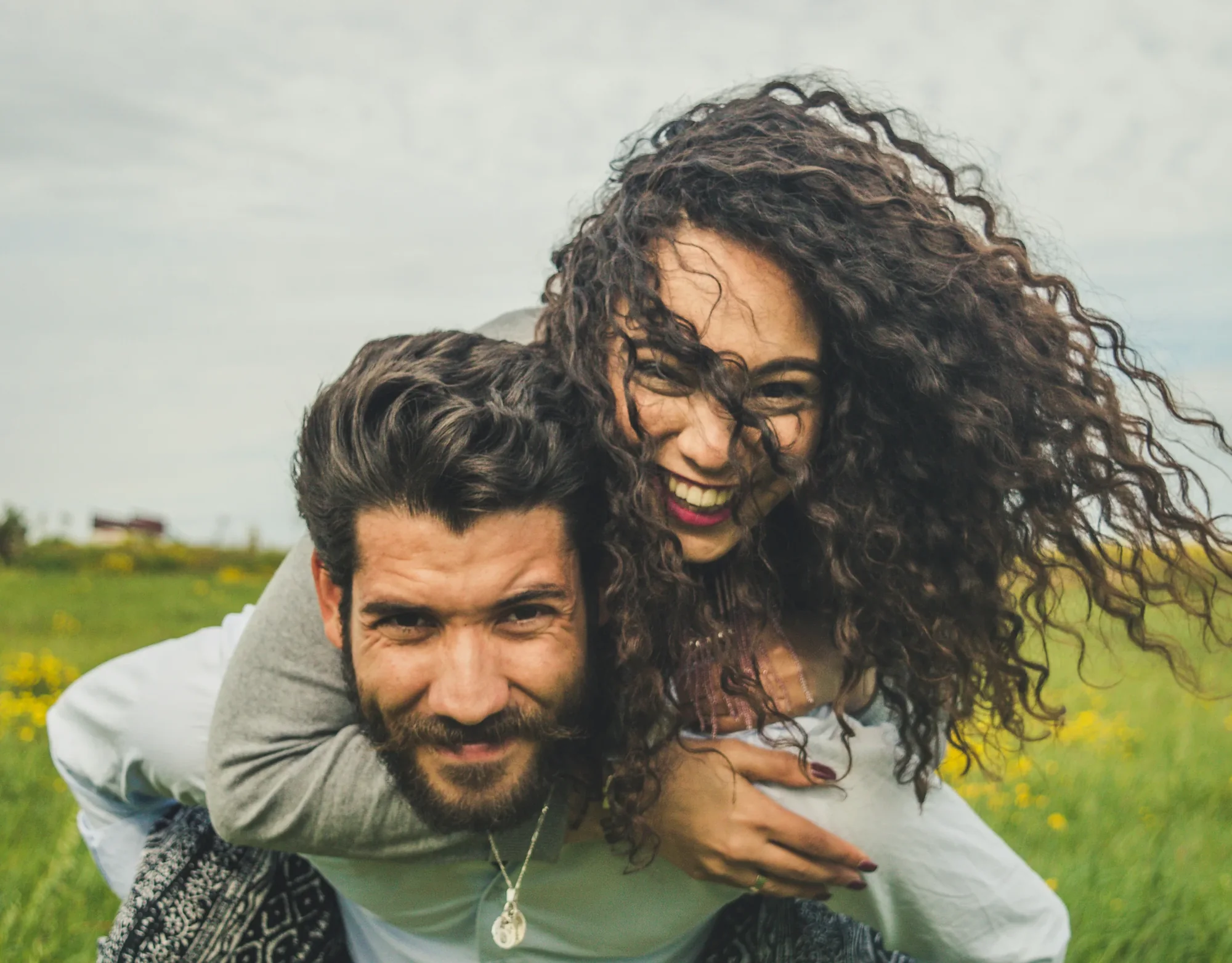 Couple laughing together outdoors