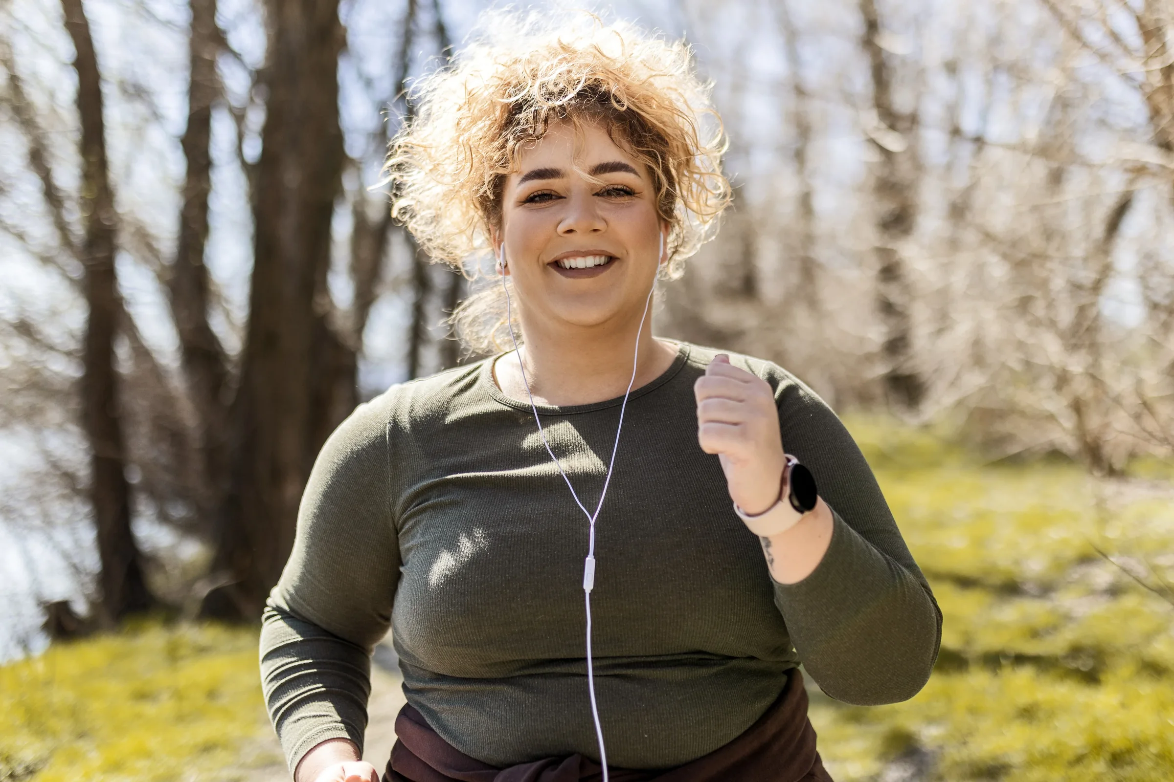 Smiling woman outdoors on a run